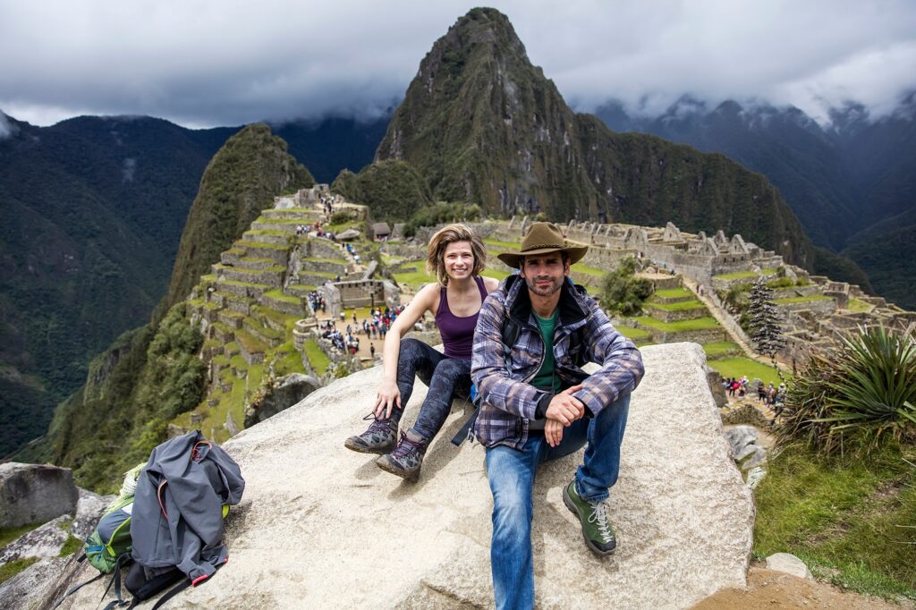 Young heterosexual couple at Machu Picchu in Peru, South America | SUPERPOBYT Travel